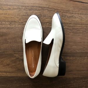White leather loafers by Intentionally Blank